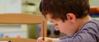 Boy learning to write letters